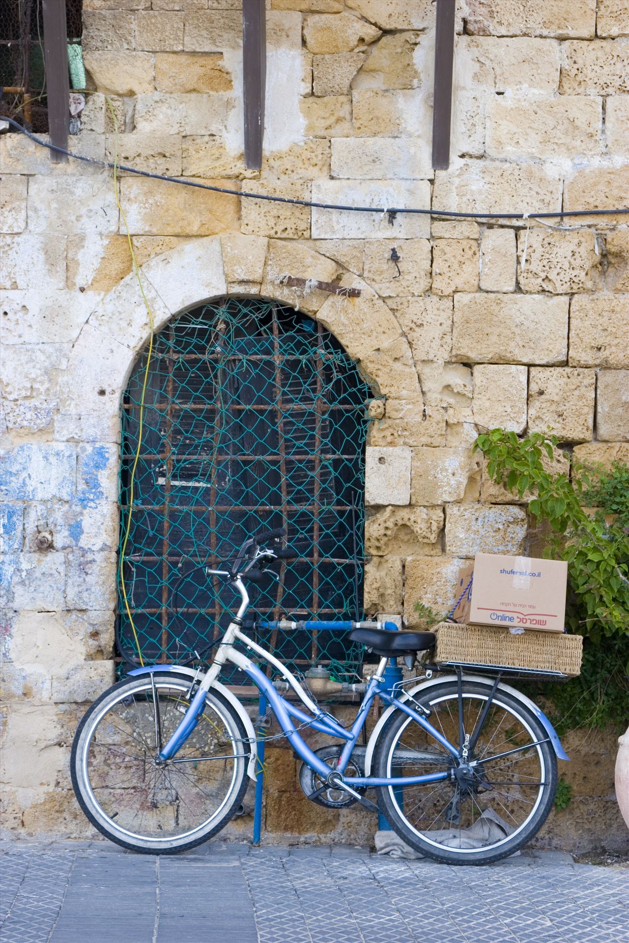 Solo Bike Parking - Bicycle near an old building by Inna Ricardo-Lax Photography
